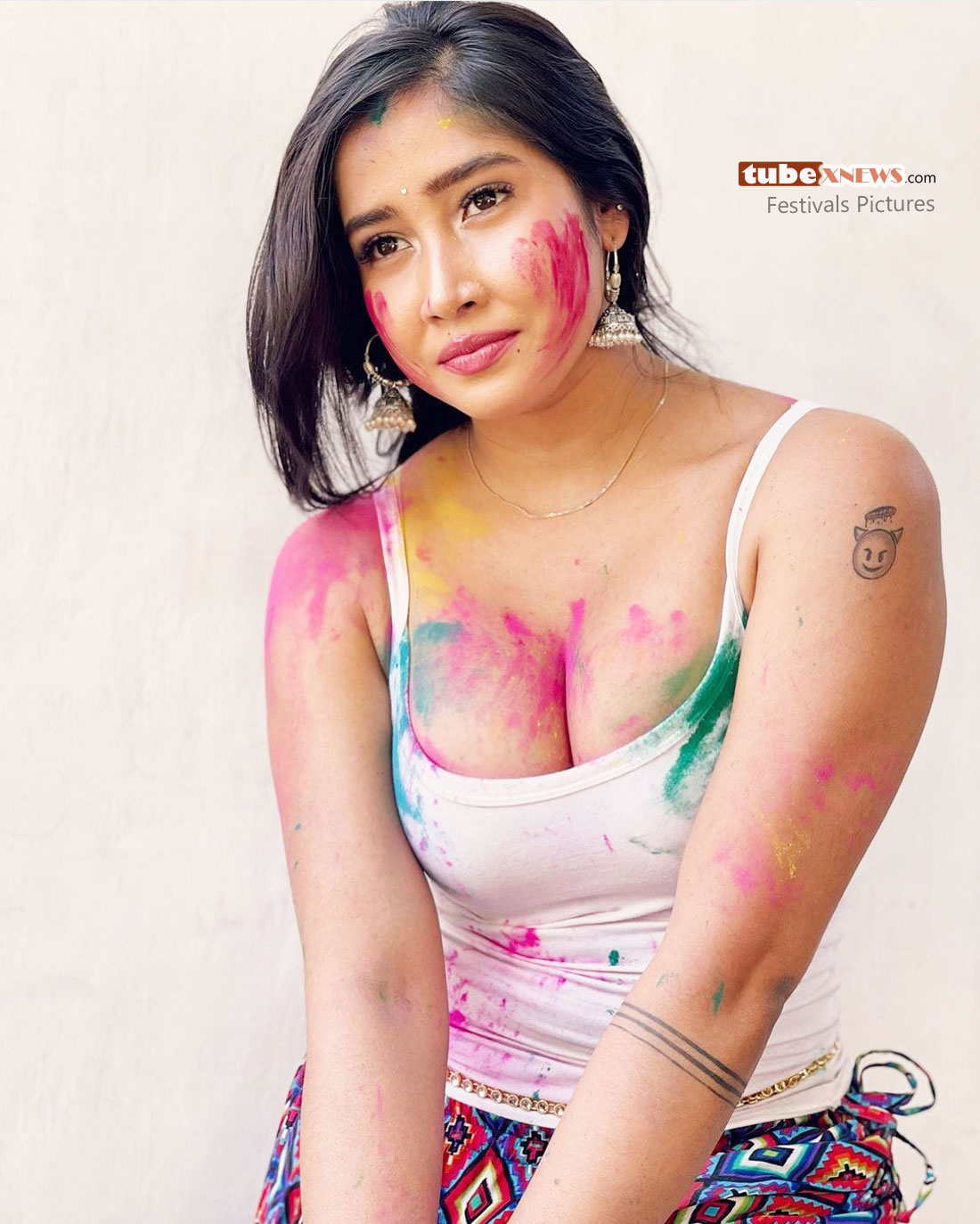 Sofia Ansari white tanktop wishing happy holi with colors
